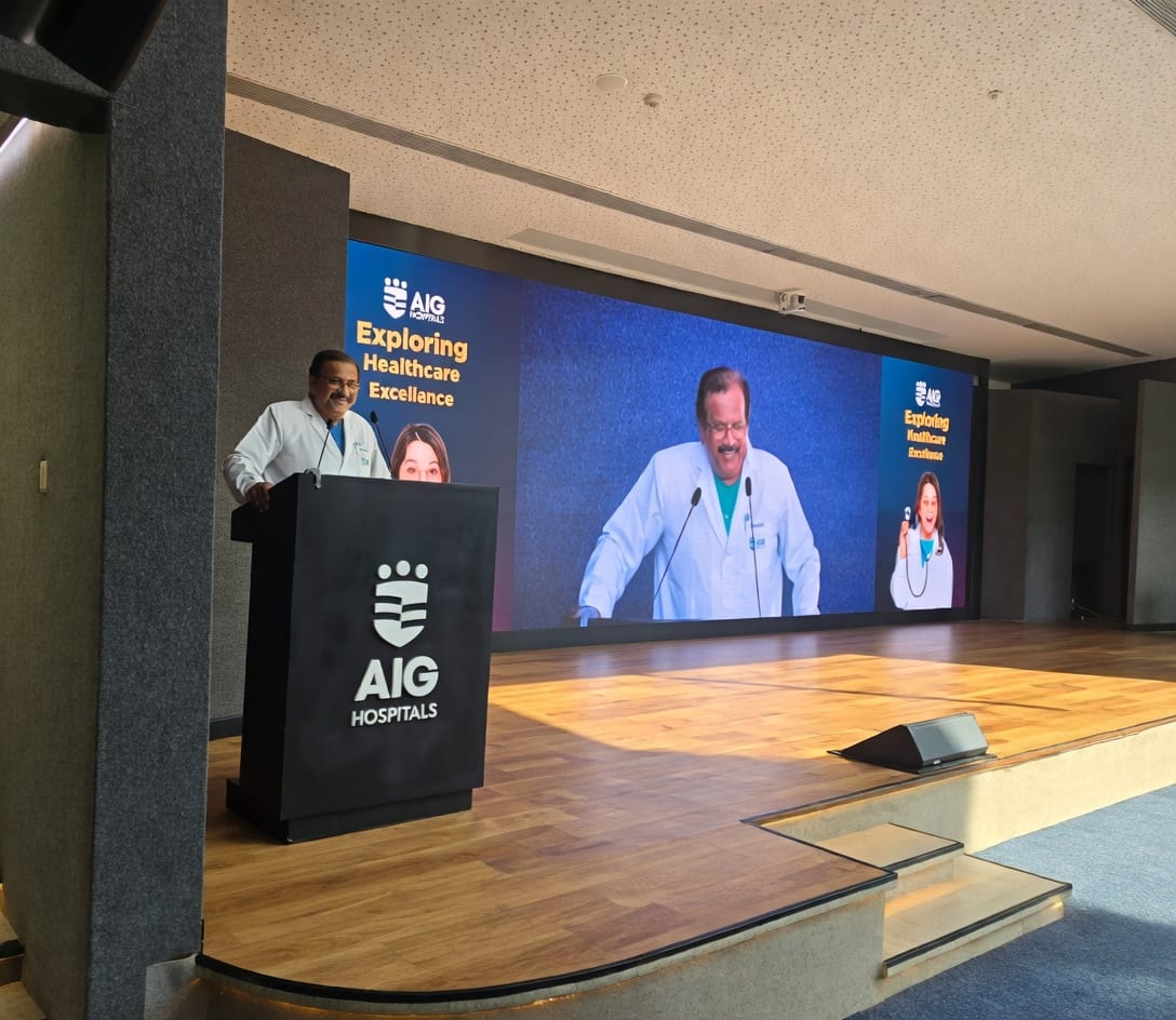 A healthcare industry expert addressing StrategyM students from the podium of a hospital auditorium